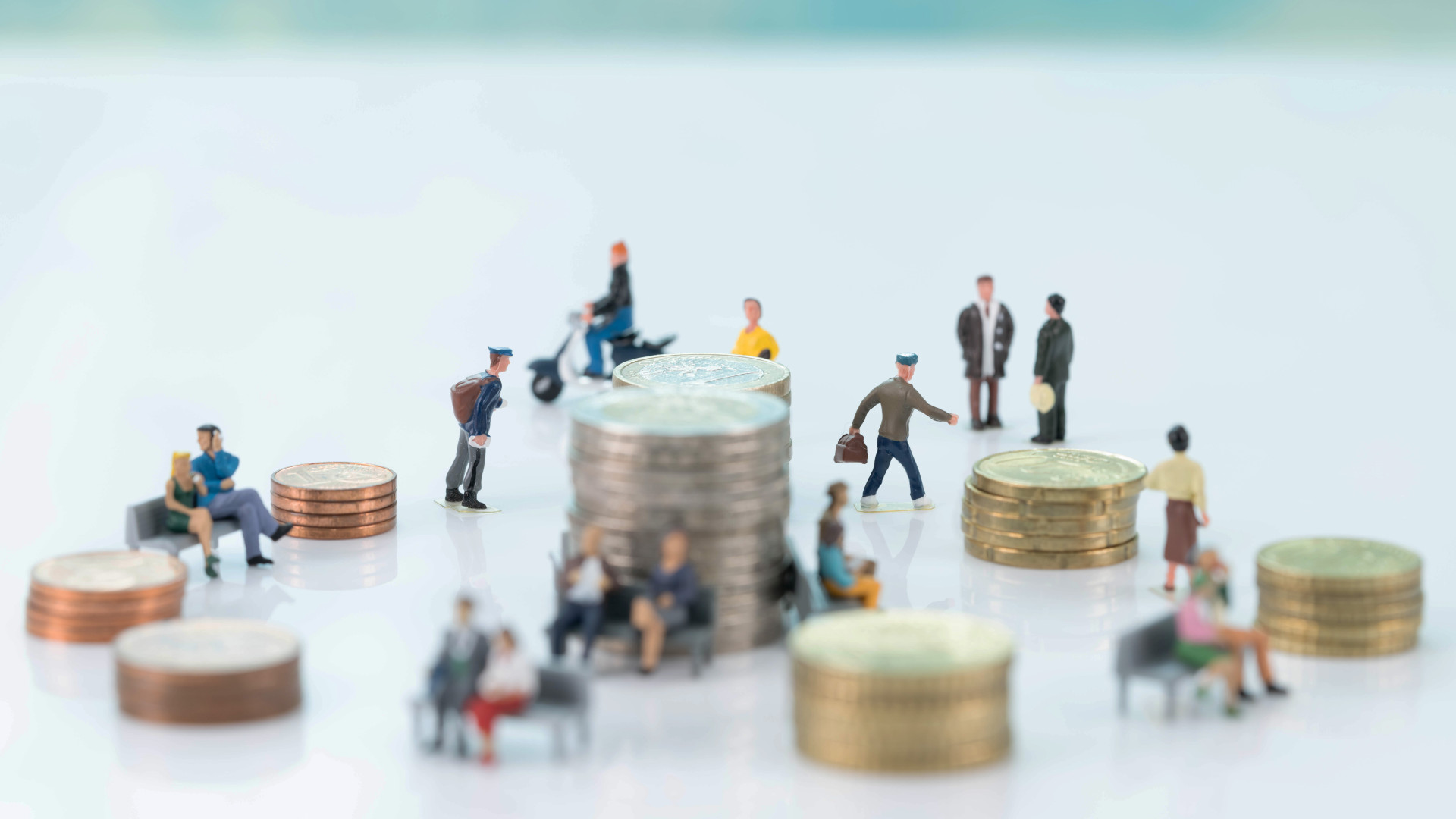 Euro coins and miniature people