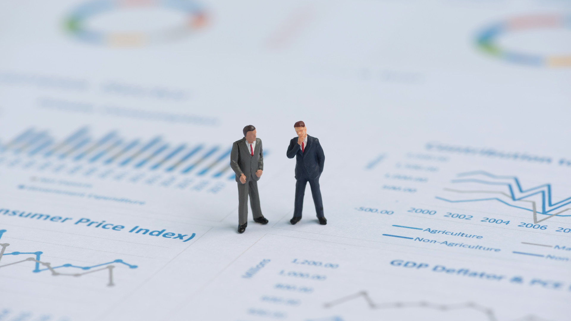 business miniature people on business graph